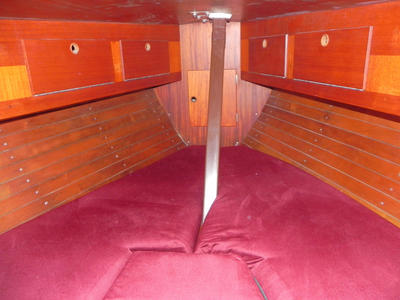 The usual infill provides a double berth around 6ft 6ins in length and up to 6ft 8ins in width. There is 5ft 9ins headroom under the hatch. There are lockers on both sides above the berths and large lockers under the berths.